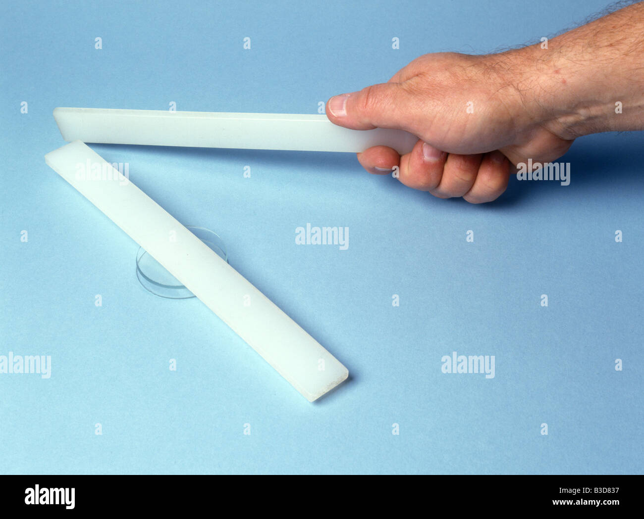 repulsion between 2 similarly charged polythene rods Stock Photo