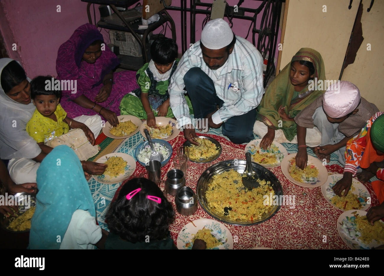 extended-muslim-family-enjoying-the-iftar-evening-meal-during-stock