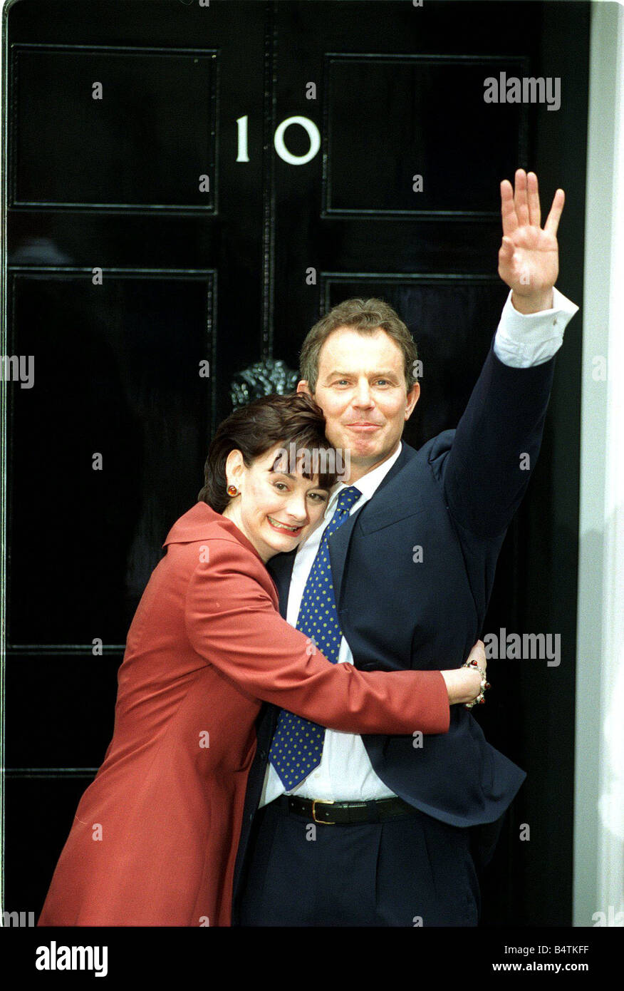 Tony Blair and wife Cherie stand at the door of 10 Downing Street Stock