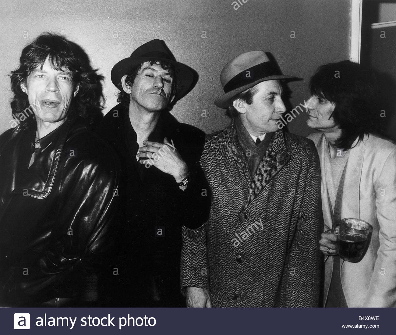 The Rolling Stones pop group in coats 1986 Mick Jagger Keith Richard