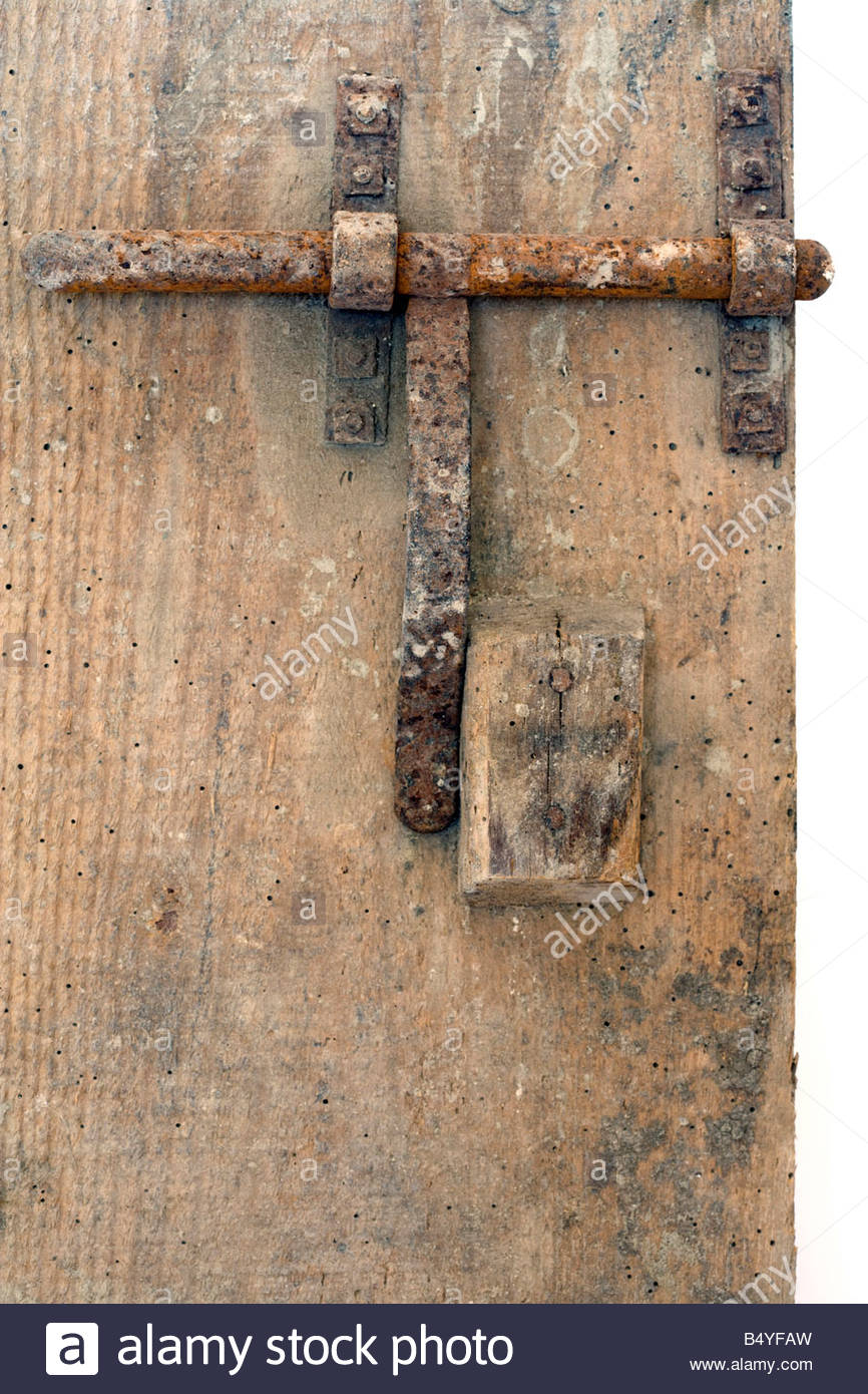 Rusty Metal Door old rusty metal bold on wooden door stock photo, royalty free Rusty Metal Door old rusty metal bold on wooden door stock photo, royalty free