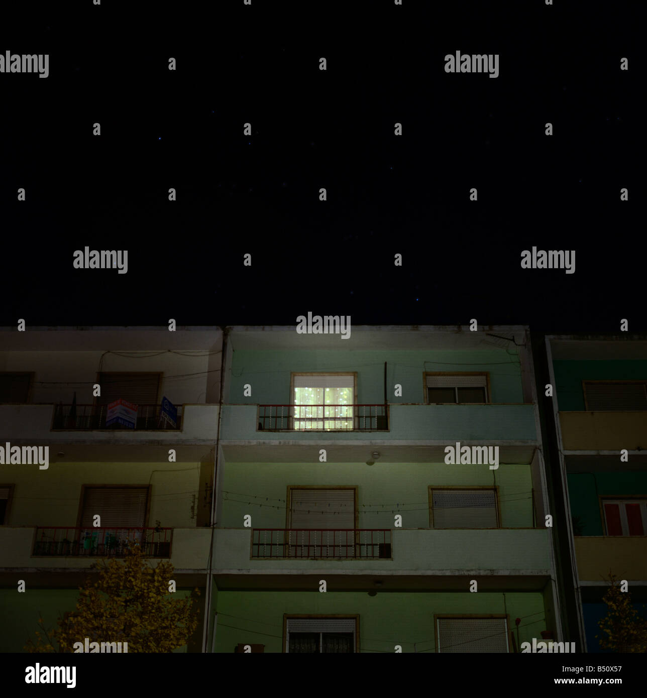 Apartment Building At Night window lit up at night in an apartment building setubal lisboa Apartment Building At Night window lit up at night in an apartment building setubal lisboa