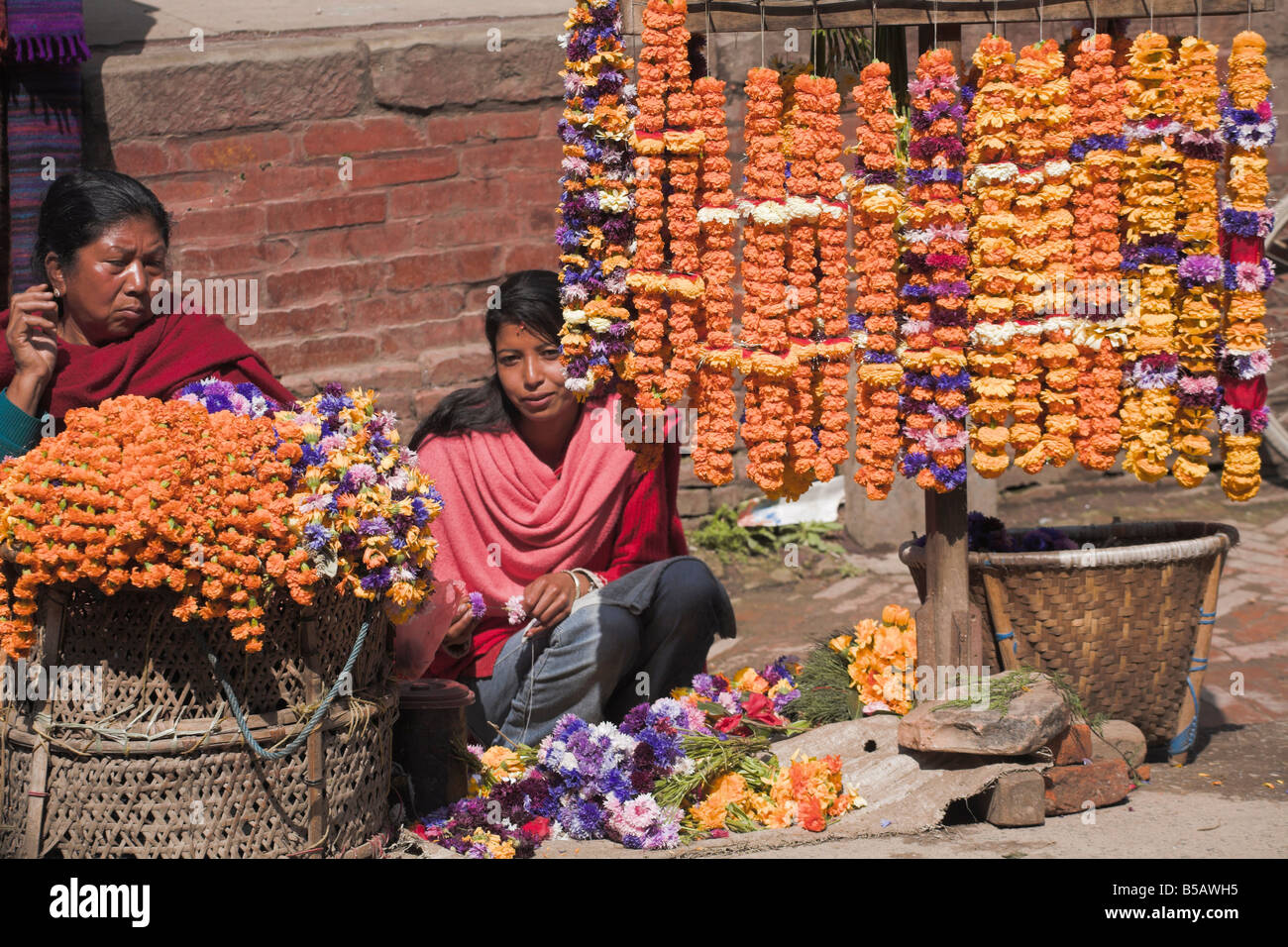 Street Vendor Selling Flower Garlands Used As Temple Offerings Stock
