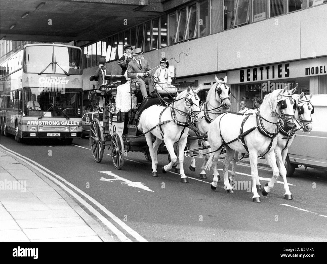 A coach and horse team driving through Newcastle city centre to Stock Photo, Royalty Free Image