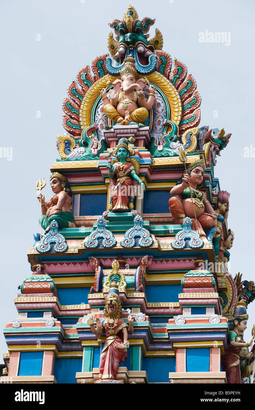 Hindu deities, painted statues, on a temple gopuram in Bangalore Stock Photo, Royalty Free Image