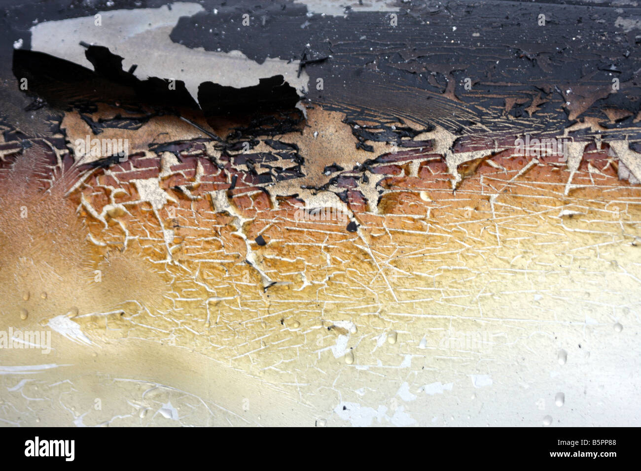 The burnt damage to the paint of a car after a fire Stock Photo