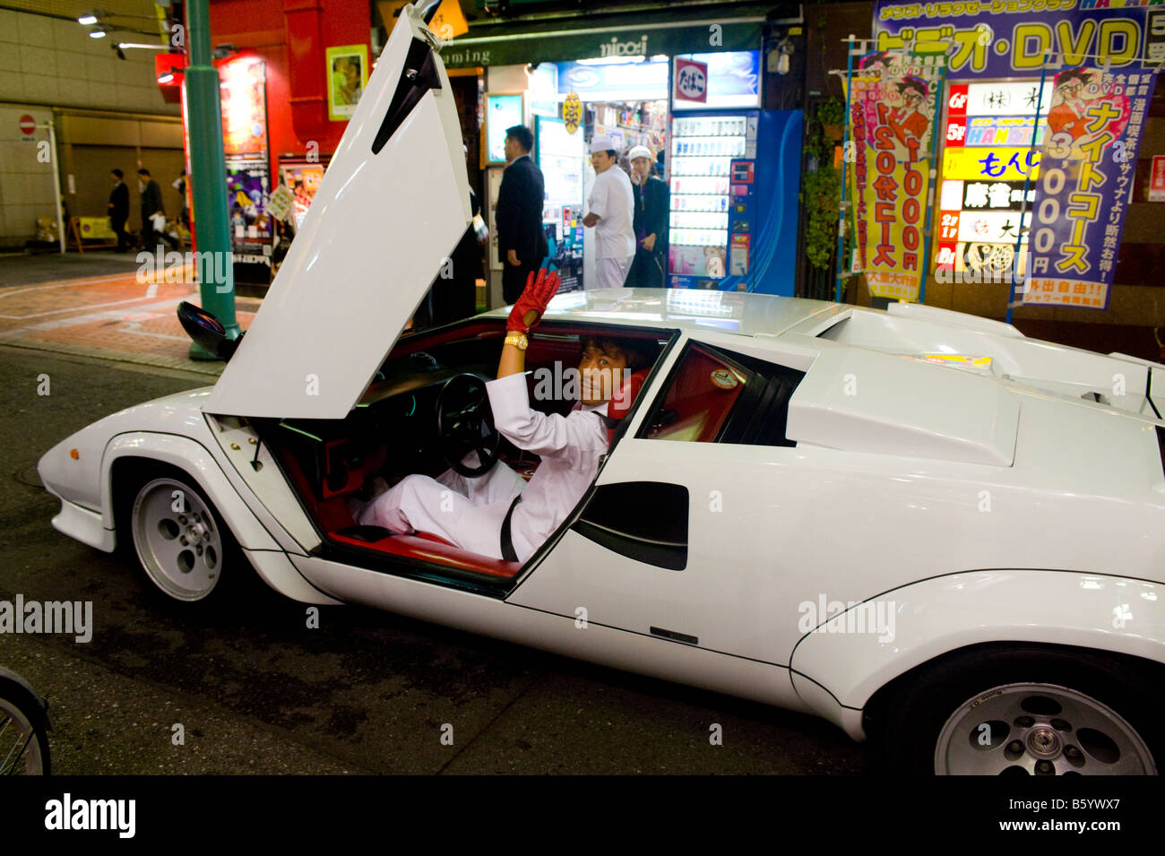 Japanese man posing in his Countach in Shinjuku, Tokyo