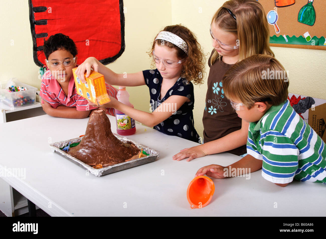 School kids working on a volcano science project Stock Photo, Royalty