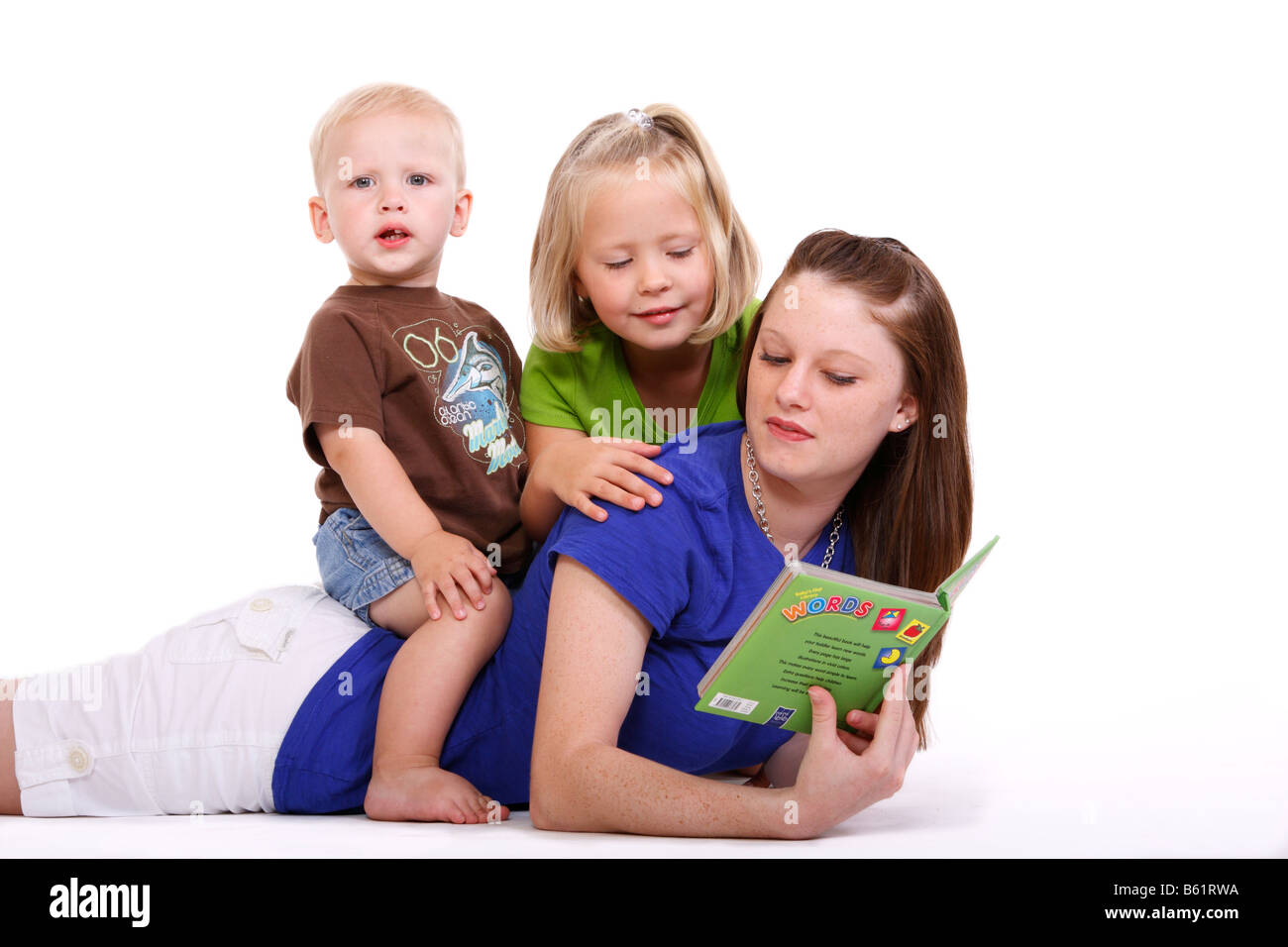 Worksheet Helping Kids To Read a teenage girl is helping two kids learn to read stock photo read