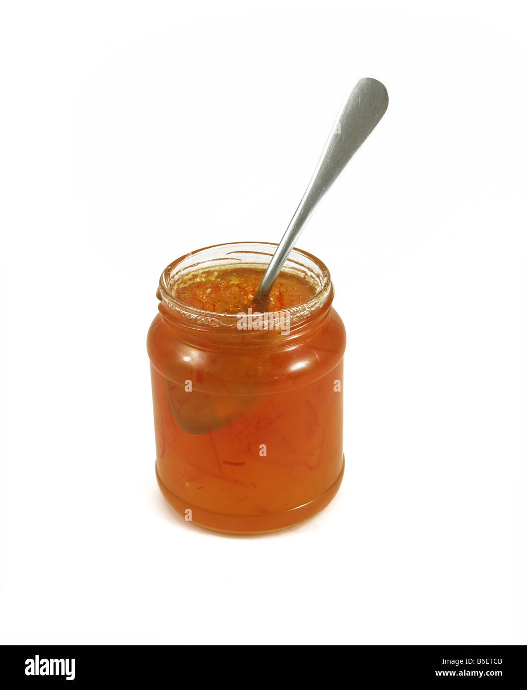 An open marmalade jar with a spoon Stock Photo, Royalty Free Image