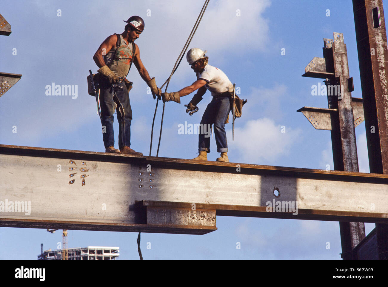 High Rise Building under construction, steel workers, walking on Stock