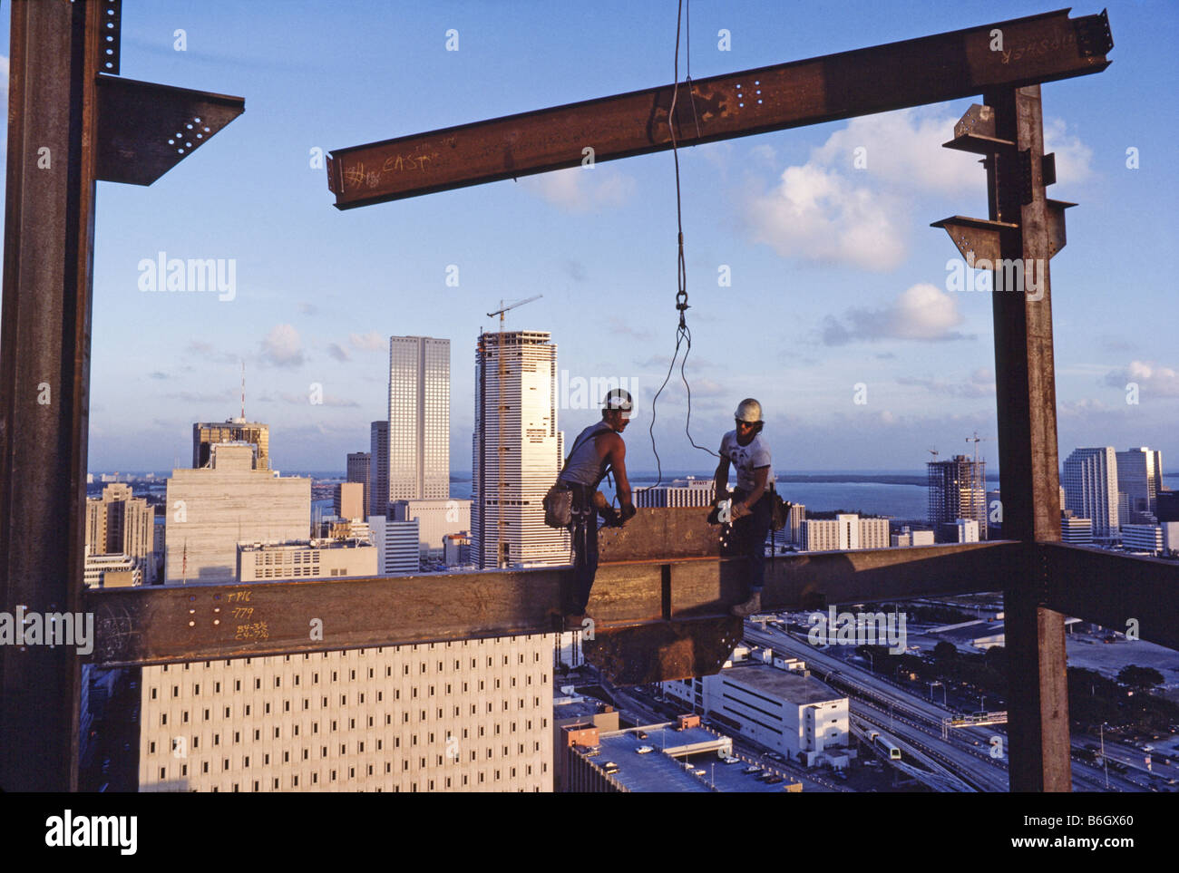 High Rise Building under construction, steel workers, walking on Stock