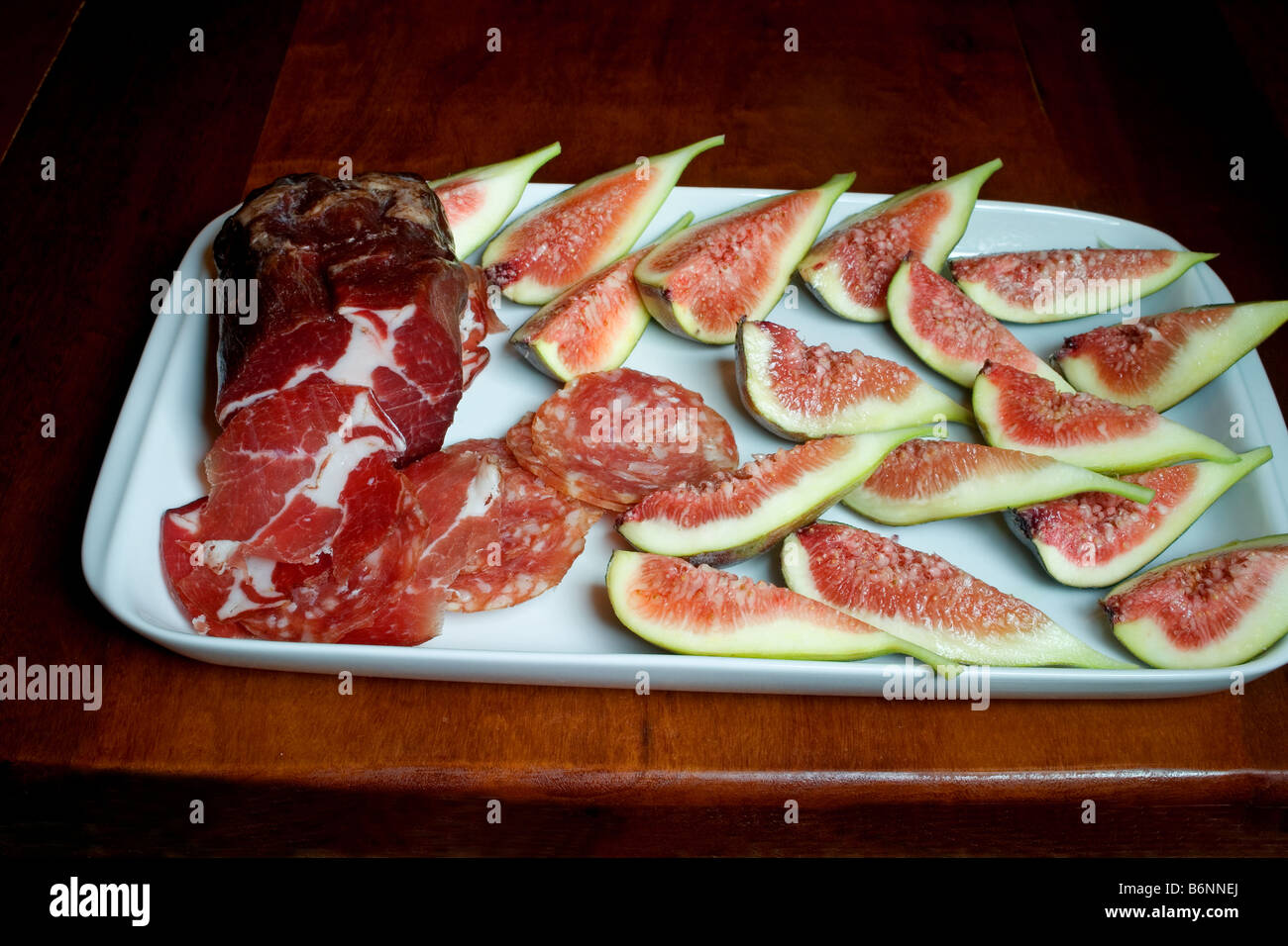 Fruit platter with Italian salami Stock Photo, Royalty Free Image
