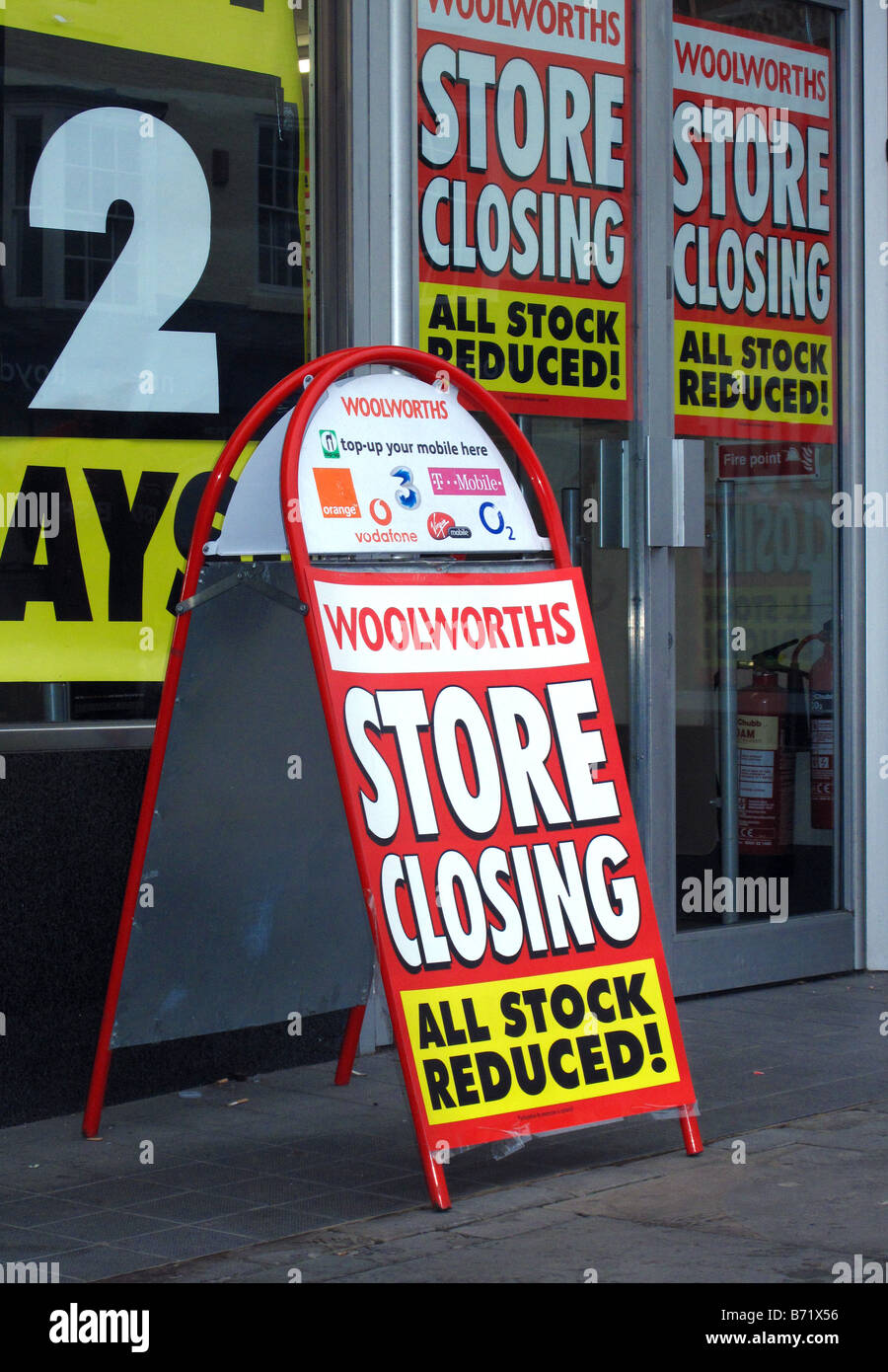 External facade & window liquidation sale signs in Woolworths store