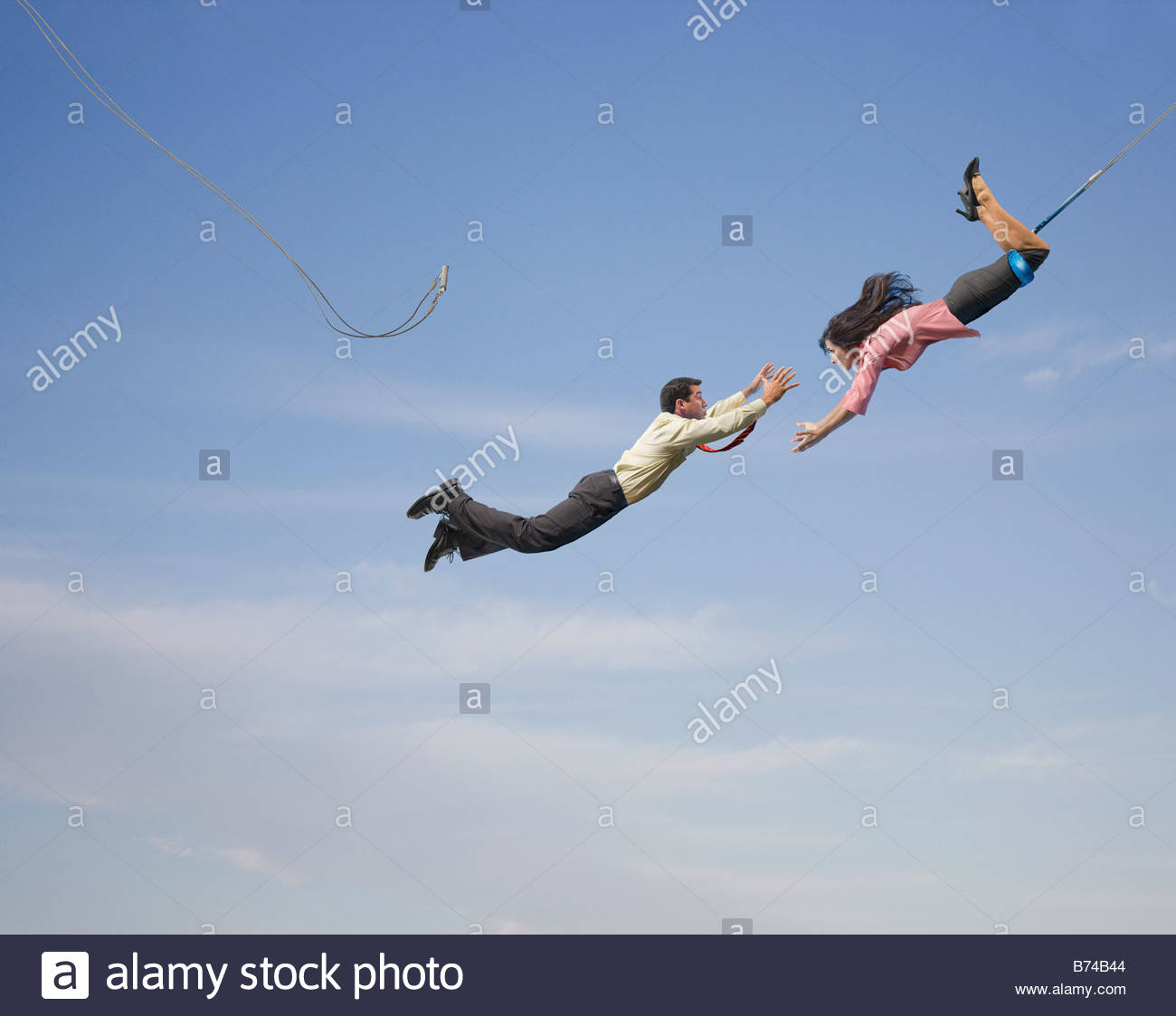 Business_people_on_flying_trapeze-B74B44