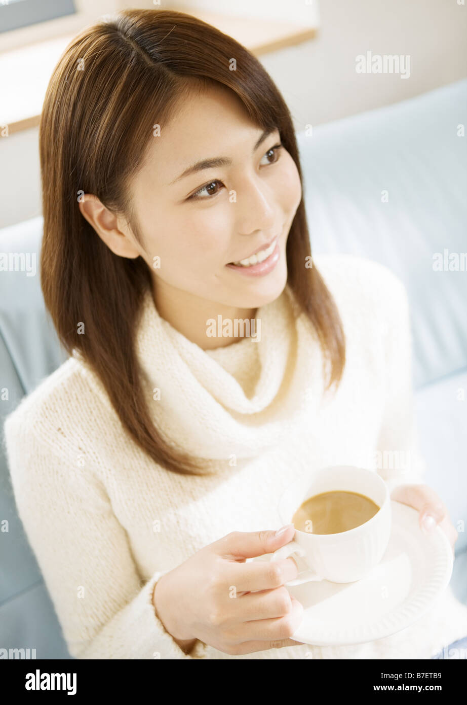 A woman drinking cafe <b>au lait</b> Stock Photo - a-woman-drinking-cafe-au-lait-B7ETB9