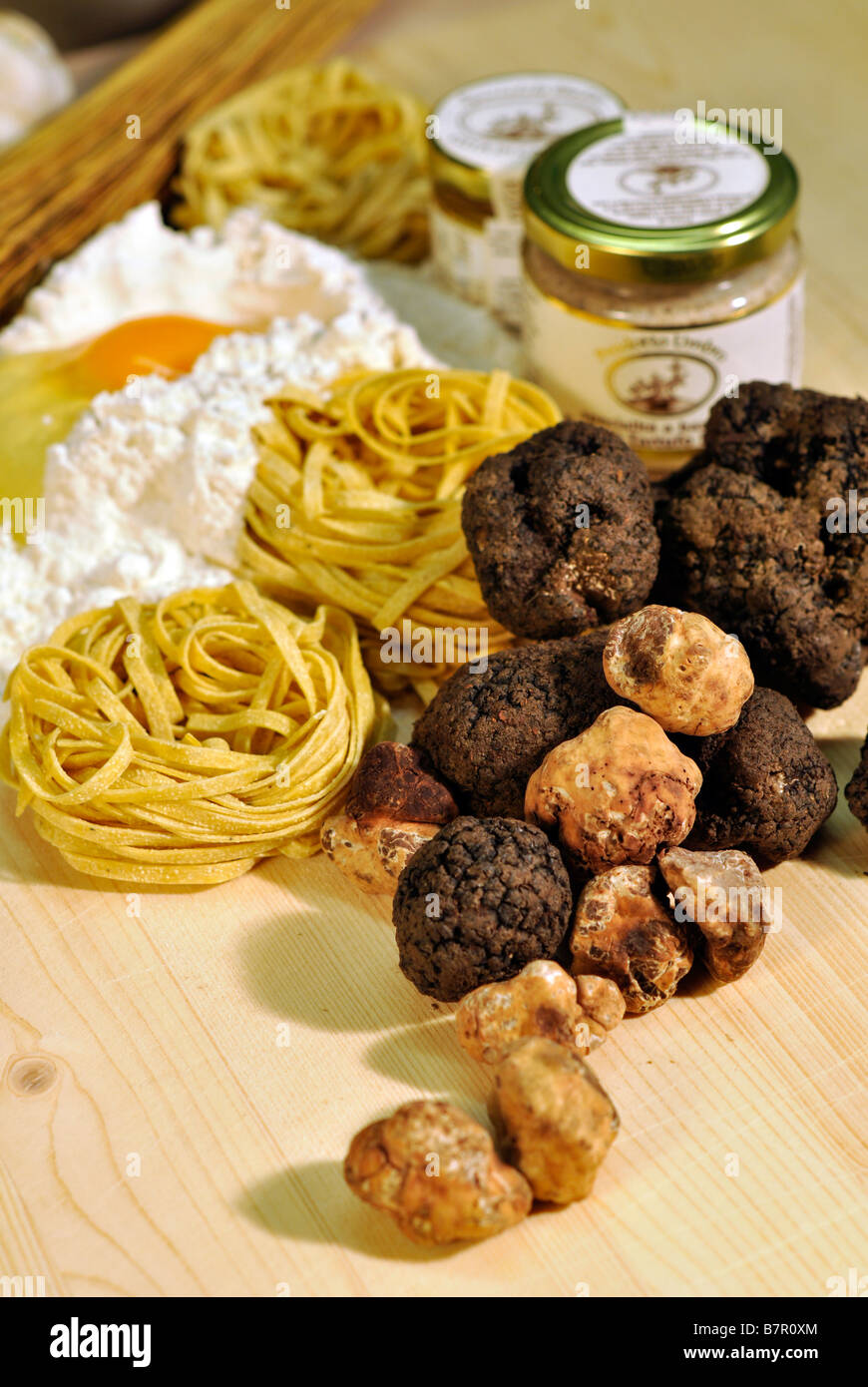 Truffle Butter Pasta fresh black and white truffles with jars of truffle butter and Truffle Butter Pasta fresh black and white truffles with jars of truffle butter and