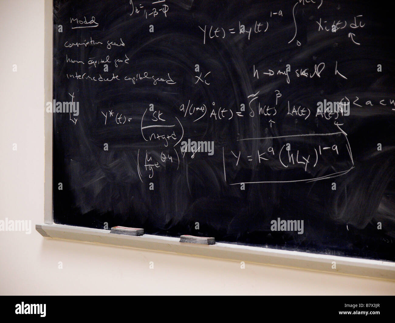 algebraic and calculus equations in chalk on a blackboard used in B7X3JR