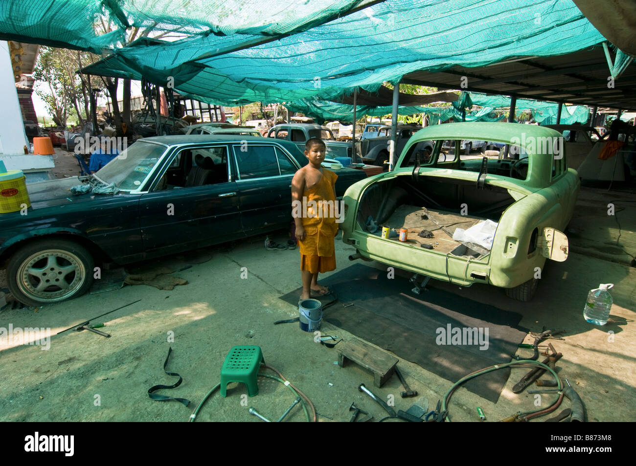 auto repair shop at the strange Wat Hua Krabeu in Bangkok Thailand