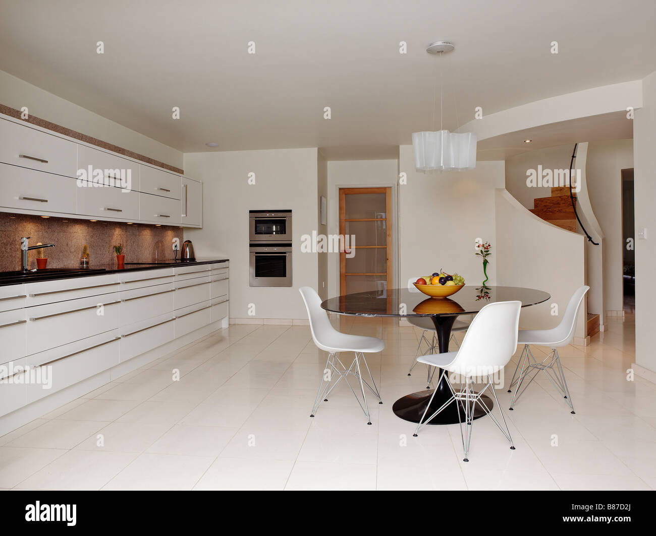 Contemporary White Kitchen a modern white kitchen with granite worktops in the uk stock photo Contemporary White Kitchen a modern white kitchen with granite worktops in the uk stock photo