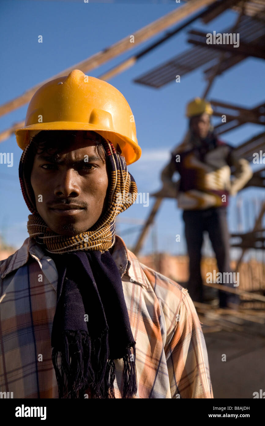 A worker wears a safety helmet on a construction site in Bangalore