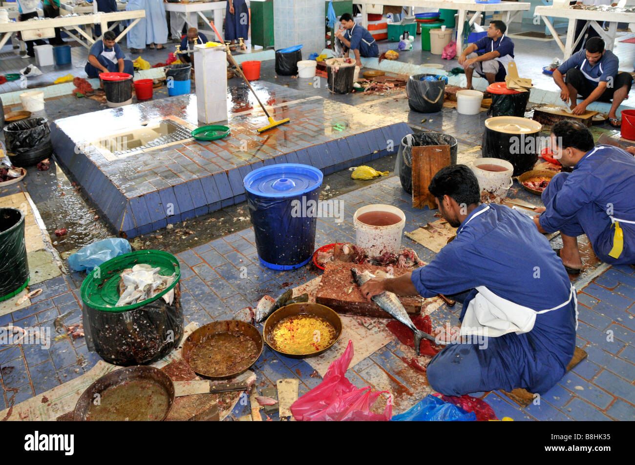 Fujairah fish market displays and workers Stock Photo, Royalty Free