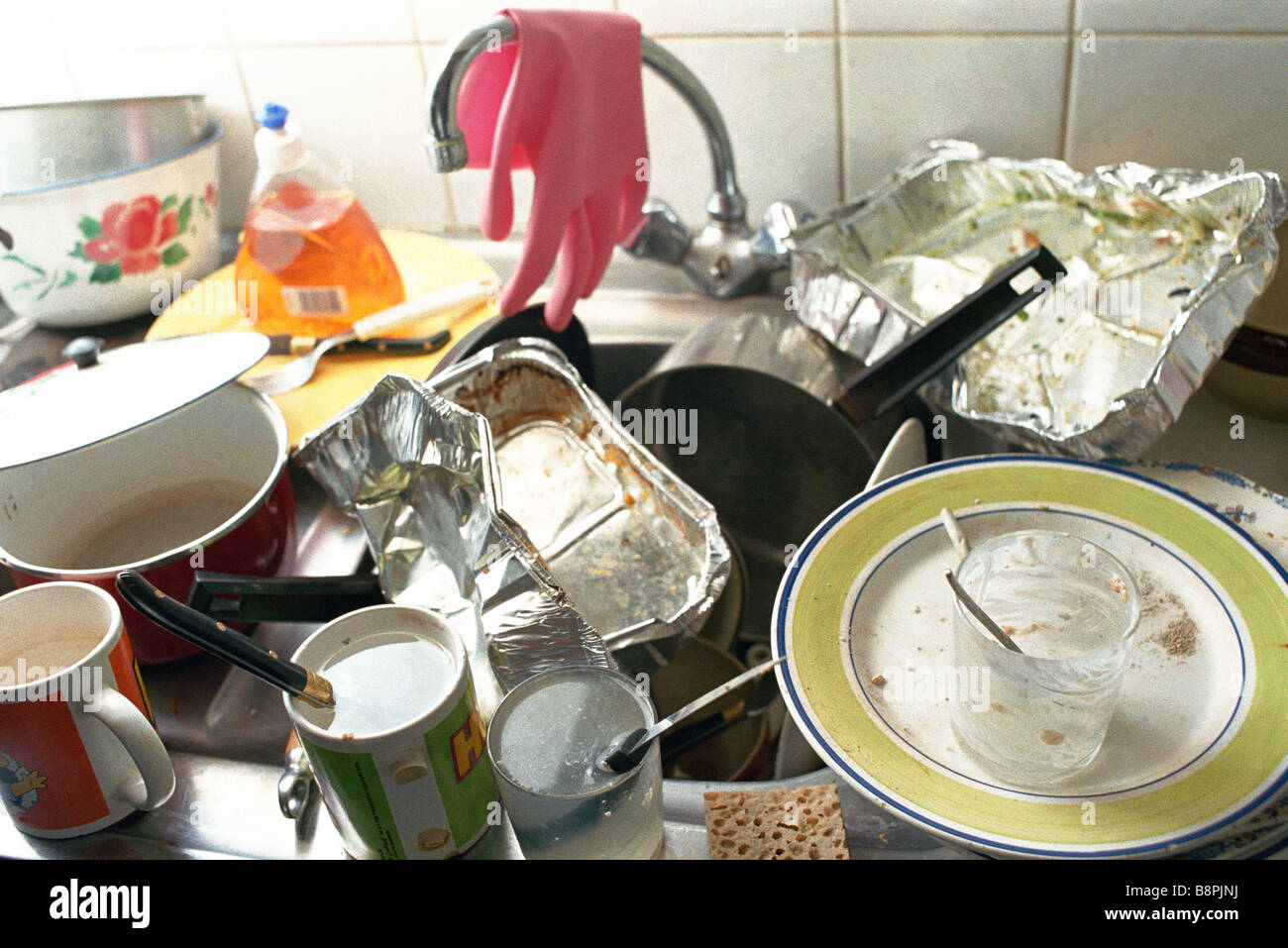 Kitchen Sink With Dishes kitchen sink, counter piled over with dirty dishes stock photo Kitchen Sink With Dishes kitchen sink, counter piled over with dirty dishes stock photo