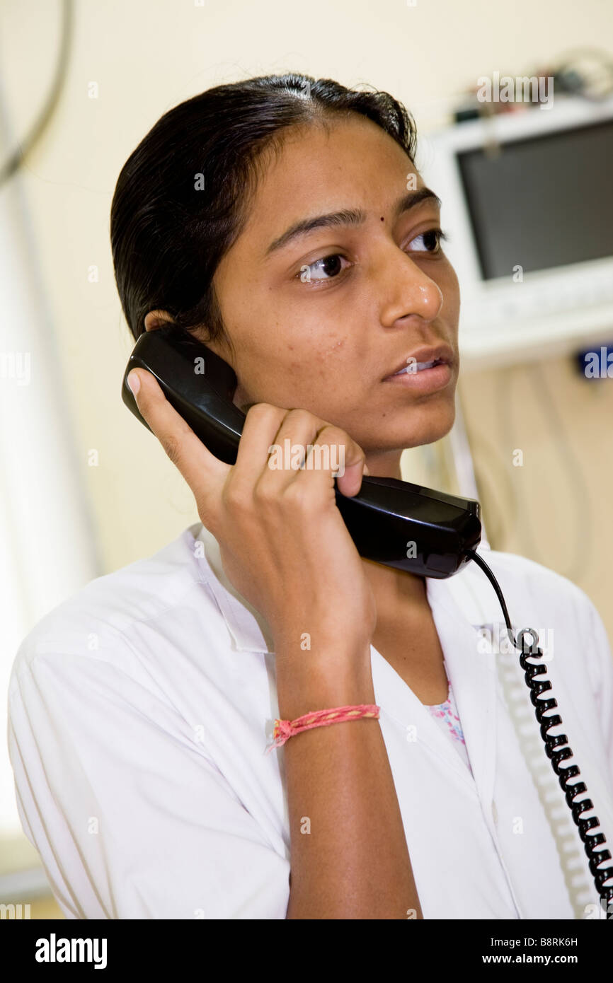 Download preview image - nurse-on-the-telephone-in-the-ward-of-the-essar-hospital-hazira-surat-B8RK6H