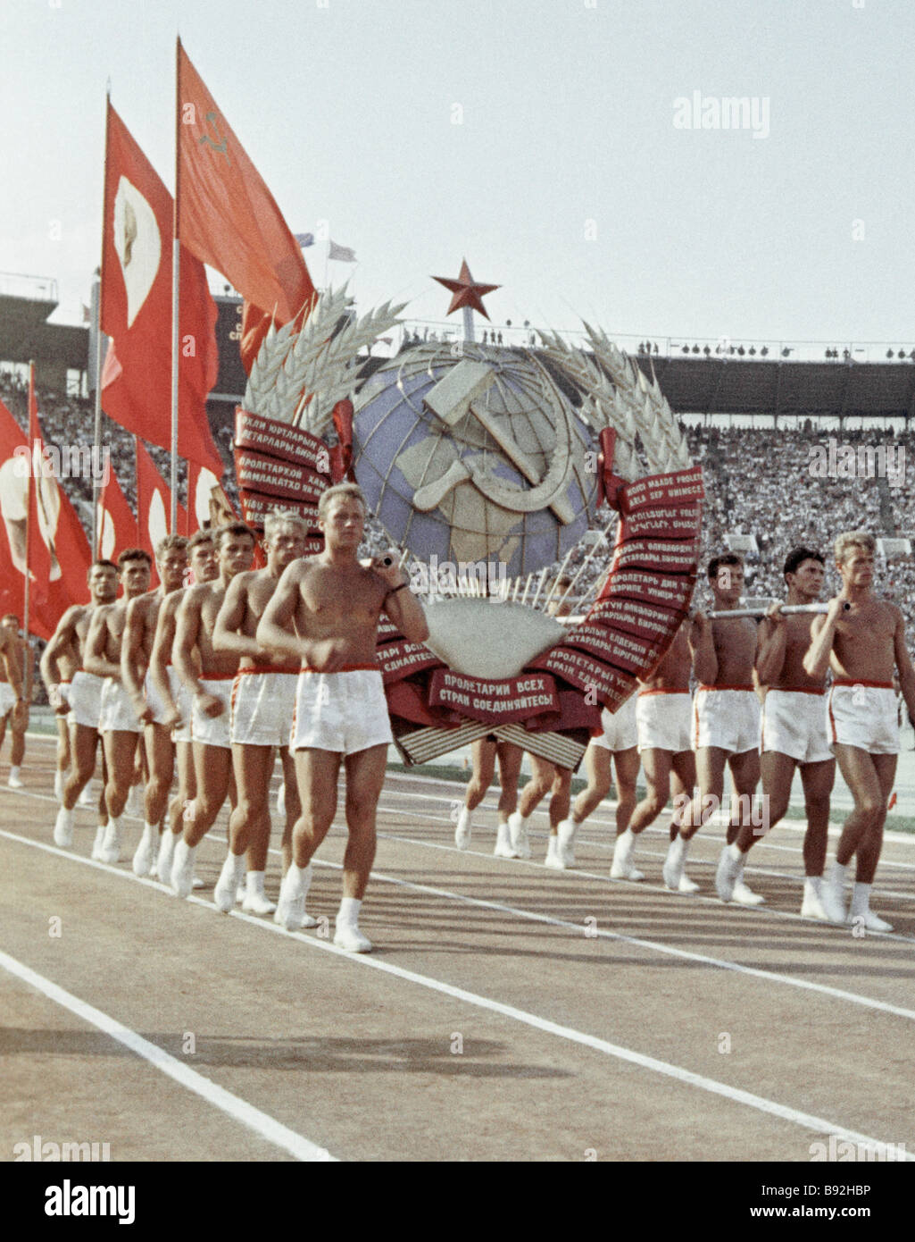 [Image: participants-in-the-sports-parade-carryi...B92HBP.jpg]