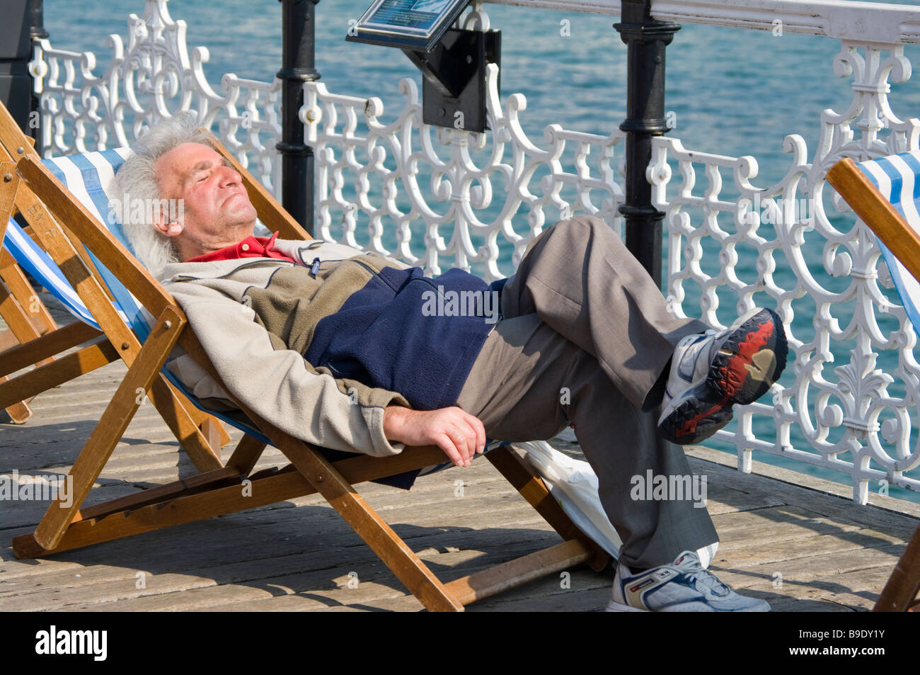 Elderly Man Person Gentleman Asleep Sleeping sat On a Deckchair Stock