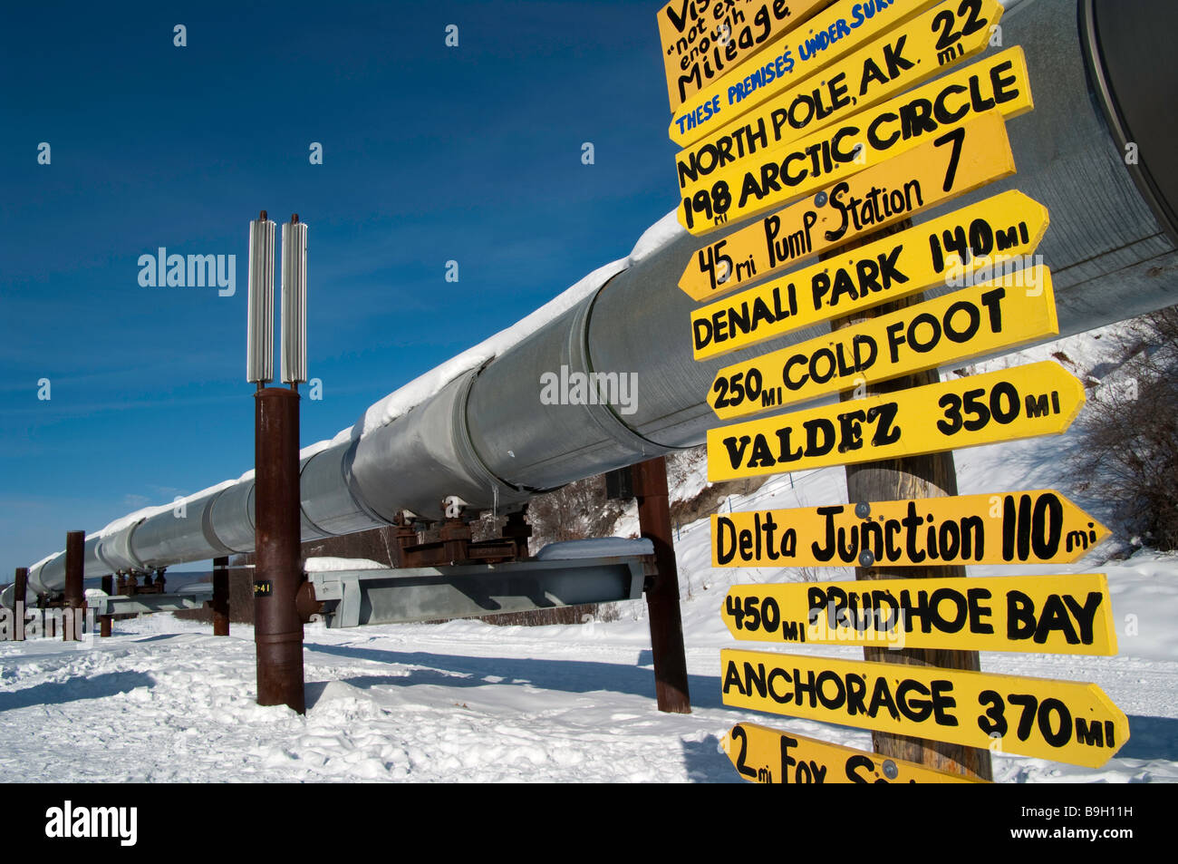 Signpost near Alaska pipeline, Fairbanks, Alaska Stock Photo, Royalty