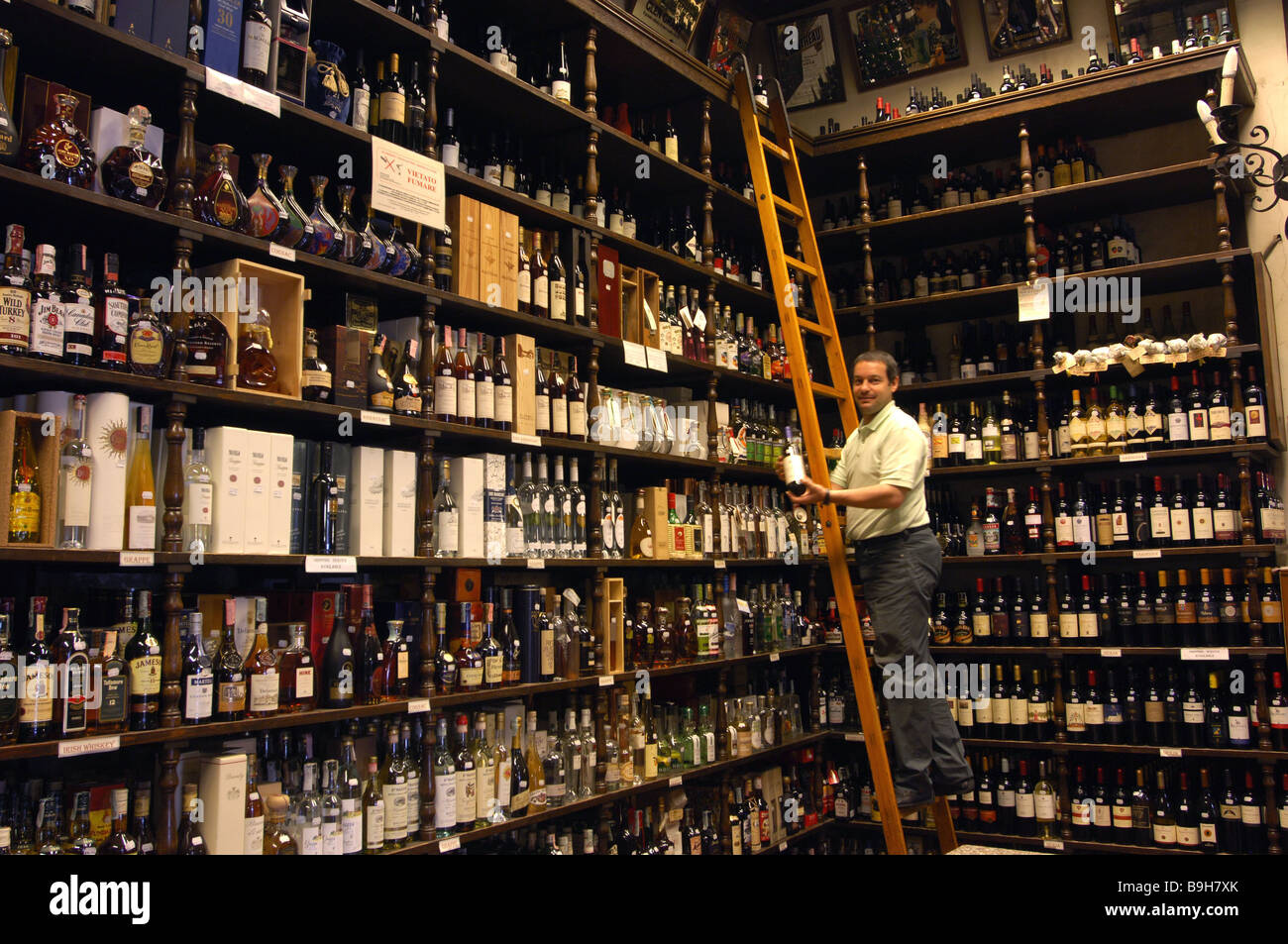Italy Rome wine store liquors salespersons leaders interior Selection Stock Photo, Royalty Free
