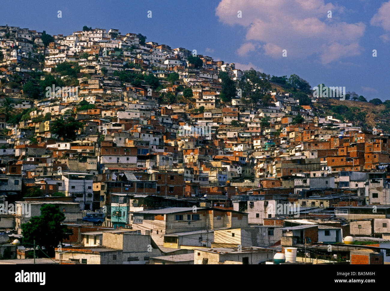 homes houses shantytown slum built along hill hillside in a Barrio in
