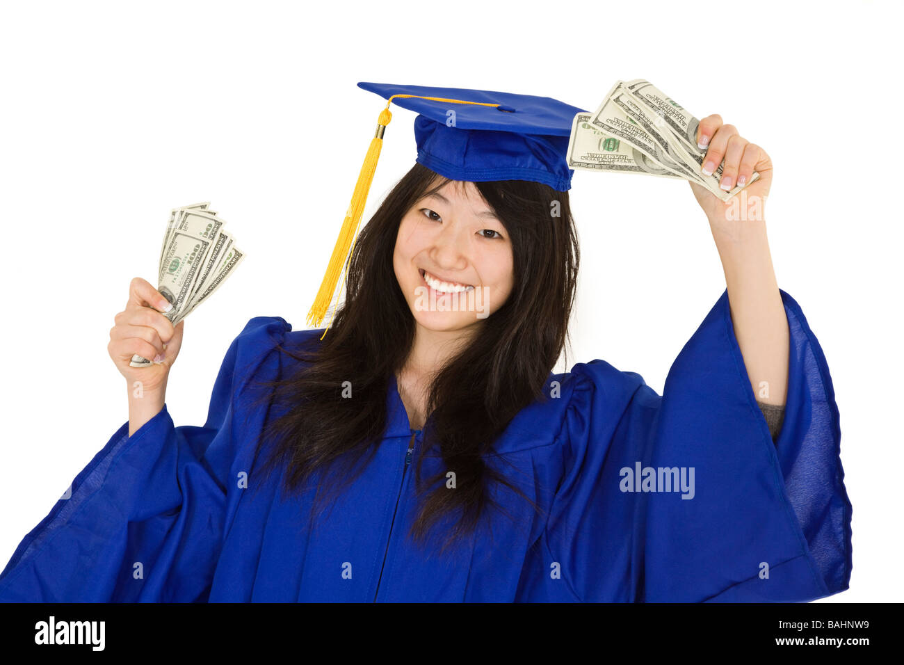 An Asian Teenager In A Graduation Gown Smiling While Holding Money ...