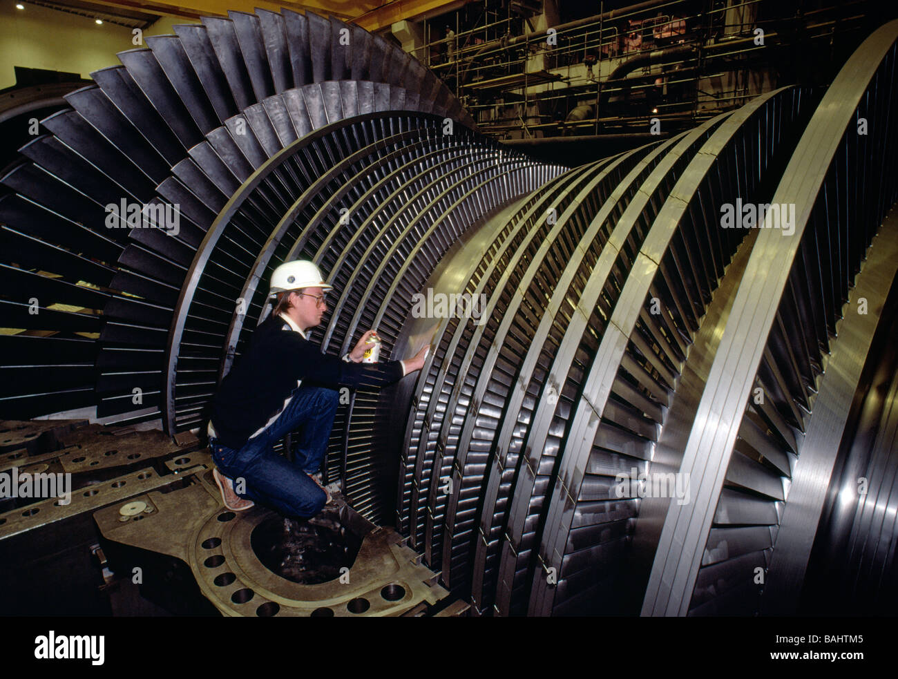 Male engineer inspecting the turbine rotors at a nuclear power plant