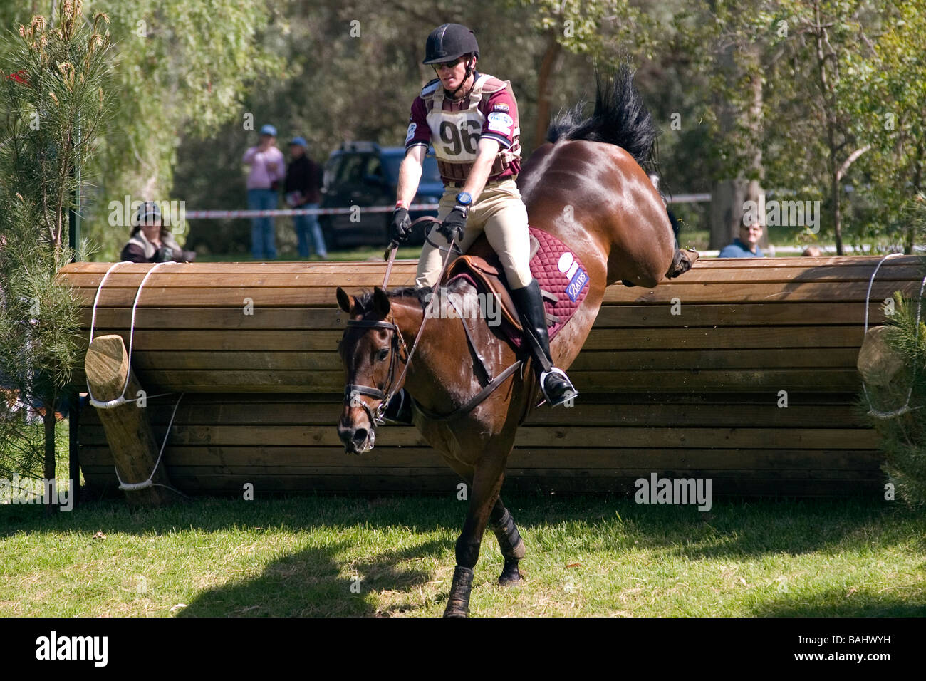 Rider and horse competing in cross country event during competition