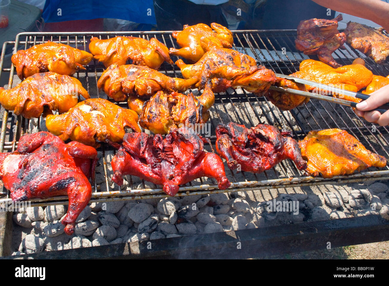 Roasting chicken on a charcoal grill Hmong Asian specialty cuisine
