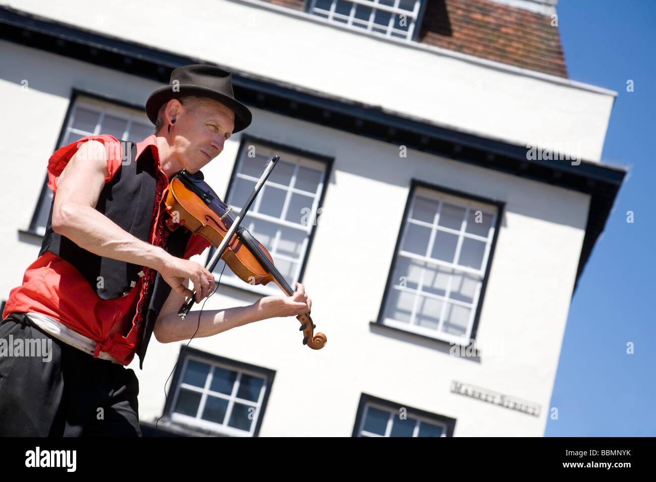 A violinplaying street entertainer, Market Street, Cambridge, UK Stock