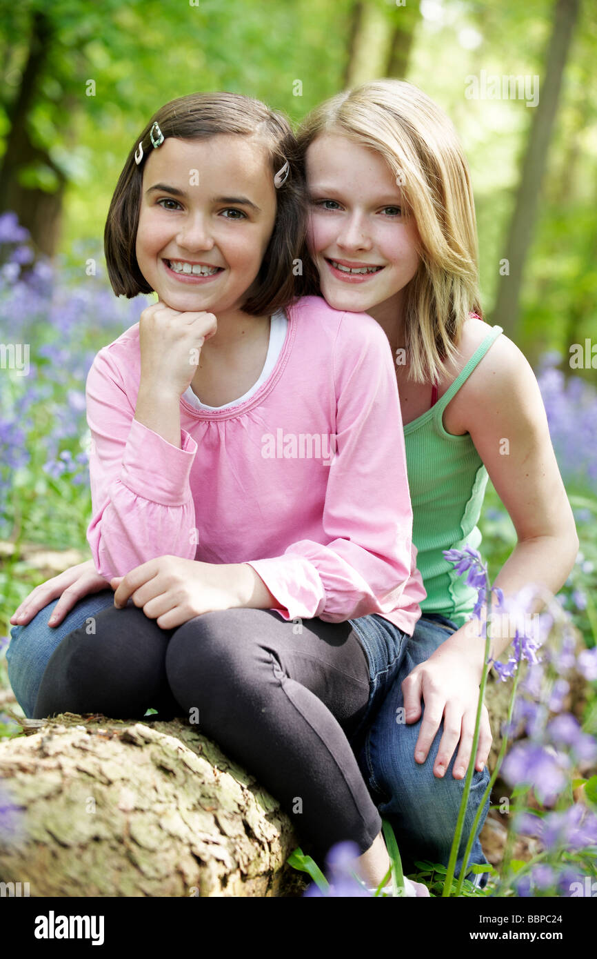 Two Young Girls Hugging In Summer Field Stock Photo 