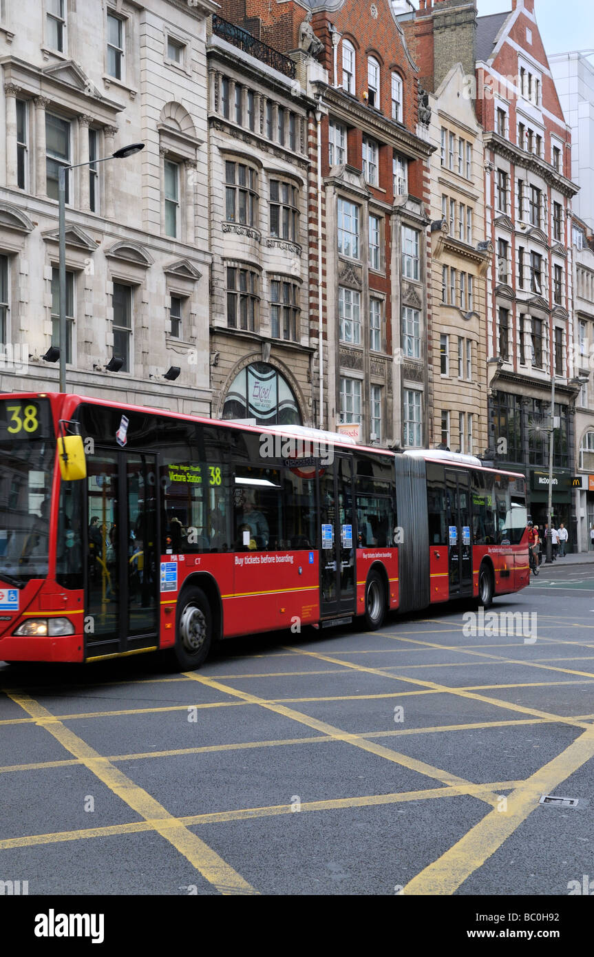 london-red-double-length-bendy-bus-crossing-junction-on-high-holborn-BC0H92.jpg