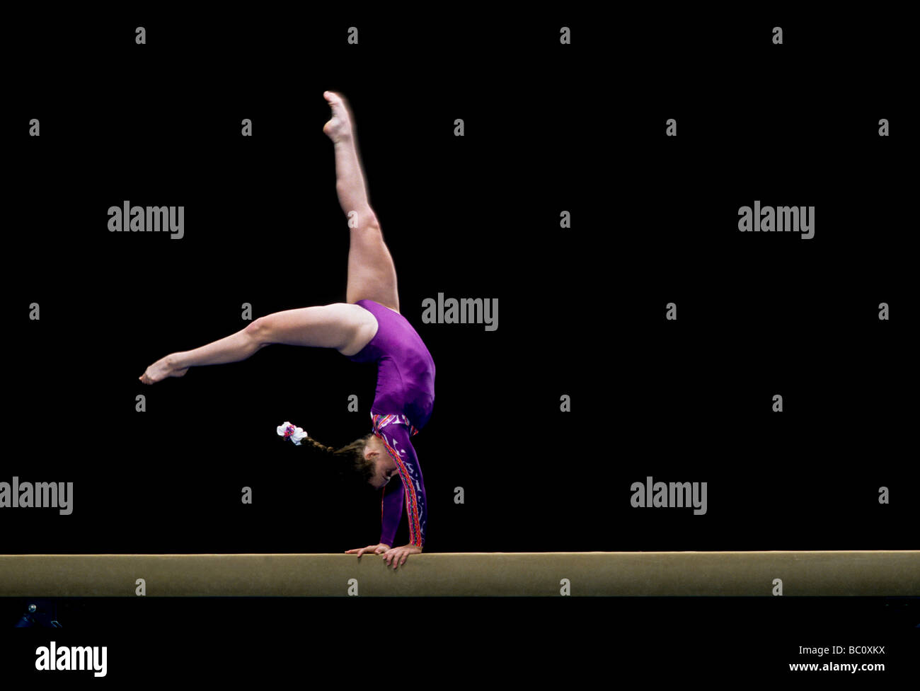 Female Gymnast Performing On The Balance Beam Stock Photo Alamy