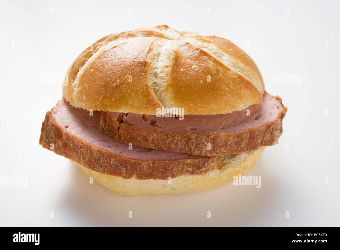 Ina Meatloaf slices of leberkäse (a type of meatloaf) in a roll stock photo Ina Meatloaf slices of leberkäse (a type of meatloaf) in a roll stock photo