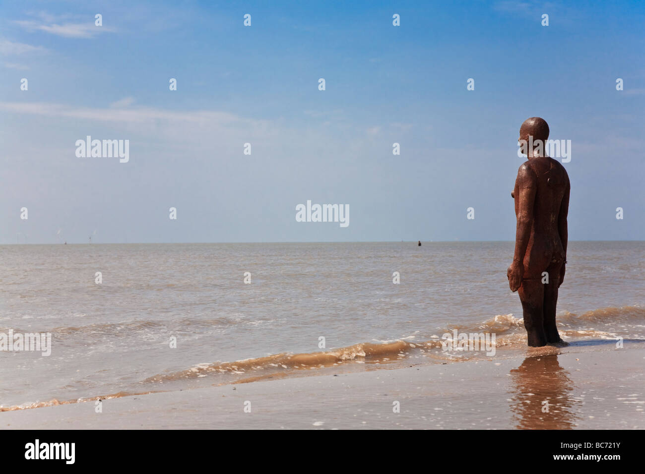 One of Antony Gormley's "Another place" iron man statues. Crosby Stock