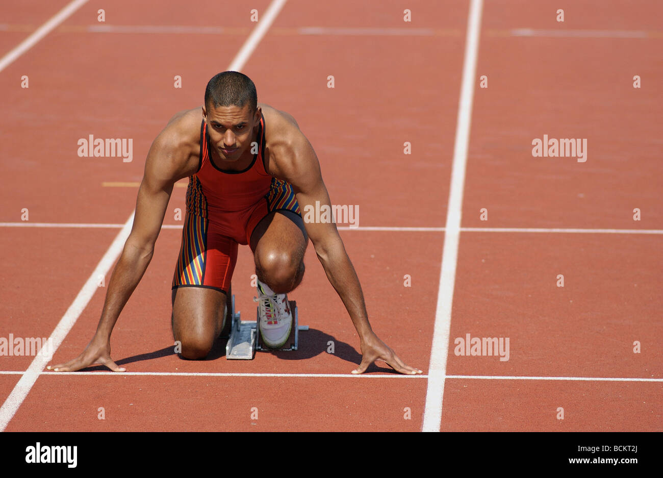 Runner at starting line, front view Stock Photo, Royalty Free Image