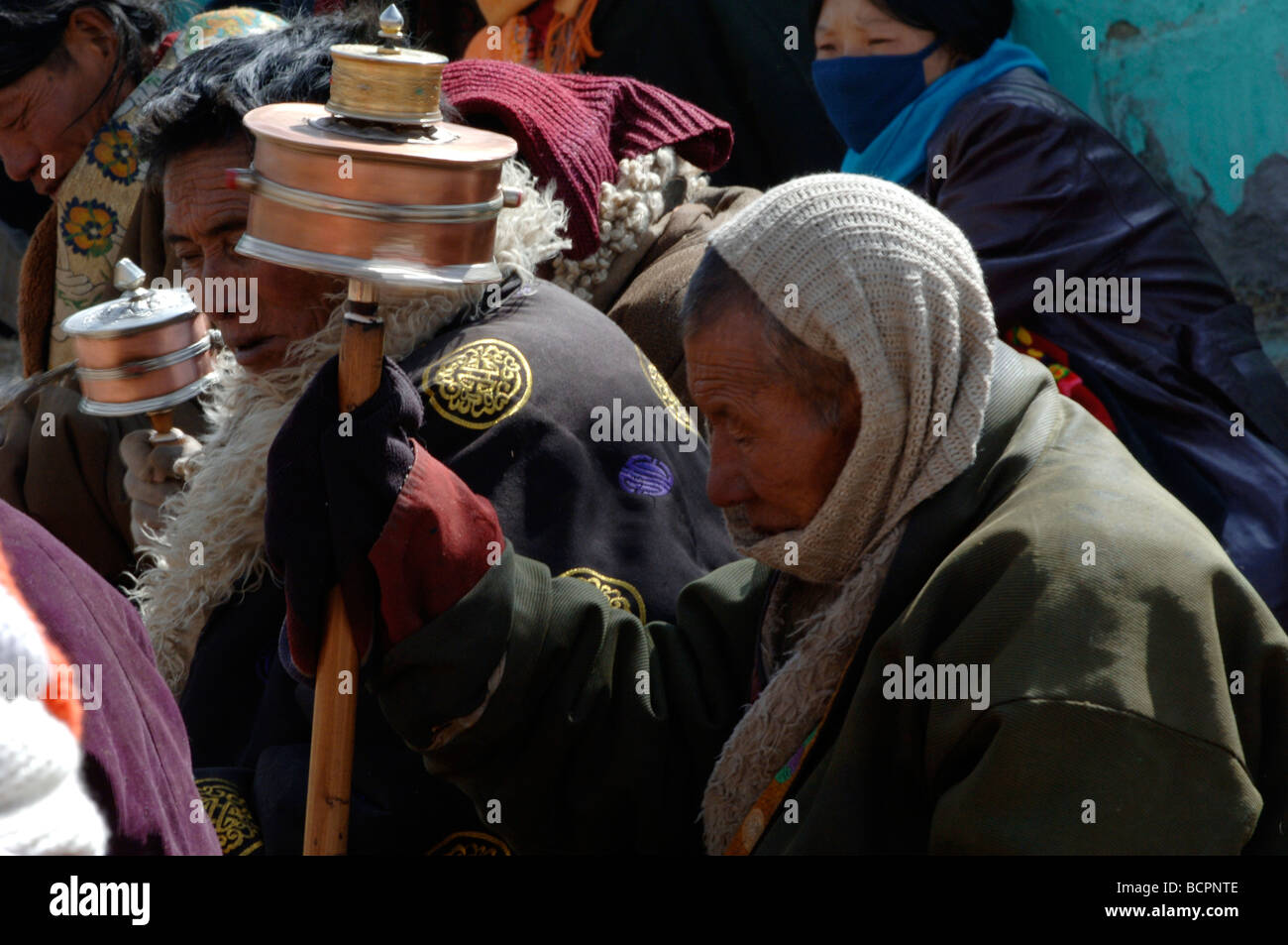 pilgrims-attending-religious-ceremony-in-a-local-tibetan-buddhism-stock