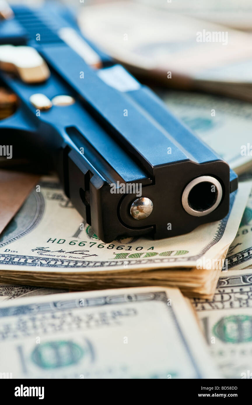 A Handgun On Stacks Of Money Stock Photo, Royalty Free ...