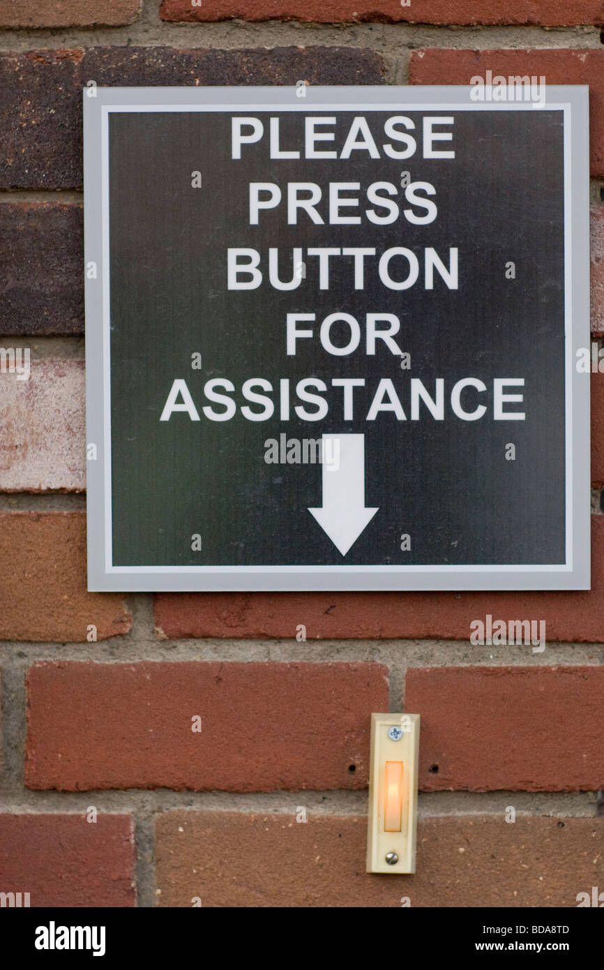 please press button for assistance sign and doorbell Stock