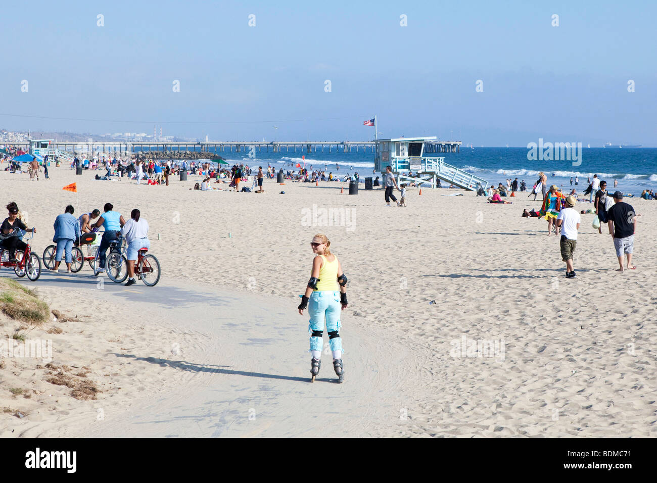 A woman roller skating Santa Monica Beach in Los Angeles, California