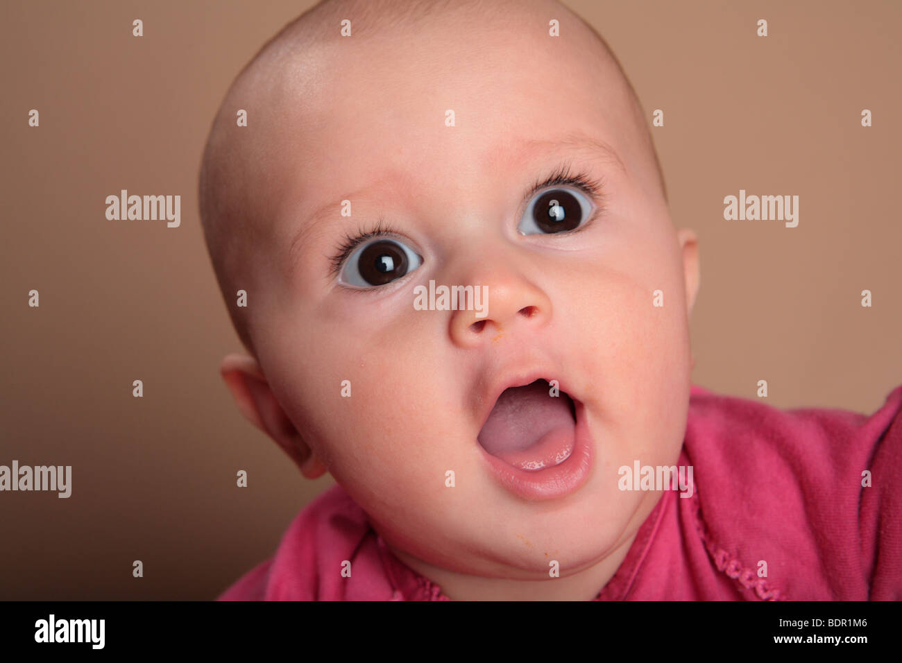 Baby Girl With Open Mouth Stock Photo Alamy