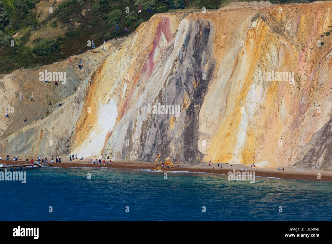 The coloured sand cliffs of Alum Bay, Isle of Wight and the cable car Stock Photo, Royalty Free